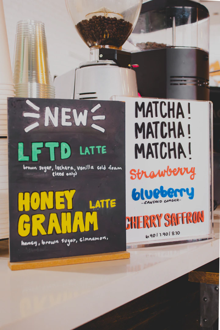 Hand-lettered signs for new lattes and matcha flavors